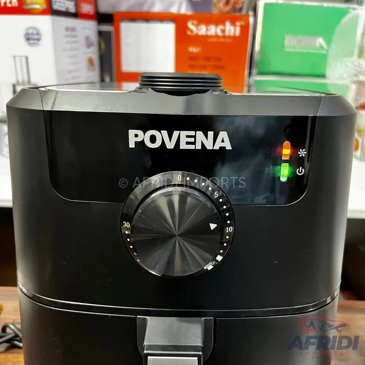 Black air fryer with a timer dial and indicator lights.