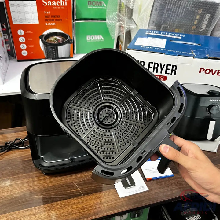 Black air fryer with a removable basket and perforated insert.