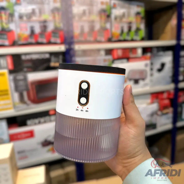 A white and clear cylindrical humidifier with two buttons and three timer settings (2h, 4h, 6h).