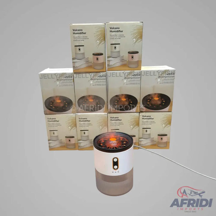 A white and transparent ’Volcano Humidifier’ with an orange glowing top, packaged in multiple boxes.