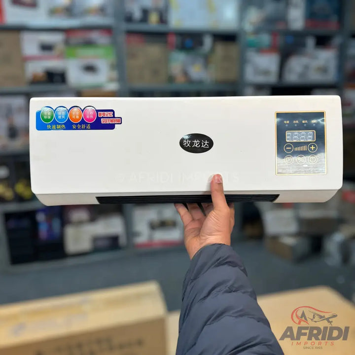 White wall-mounted electric heater with a digital display.