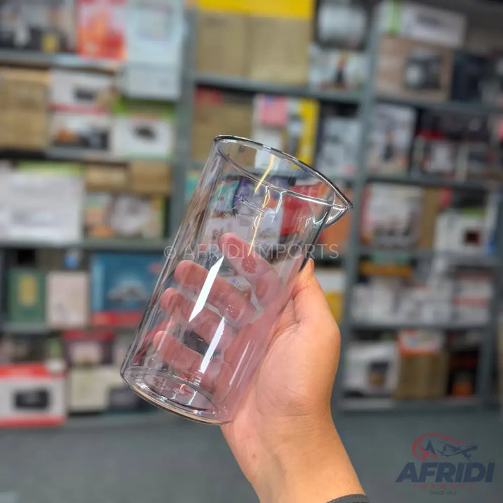 Clear plastic measuring cup with a pouring spout.