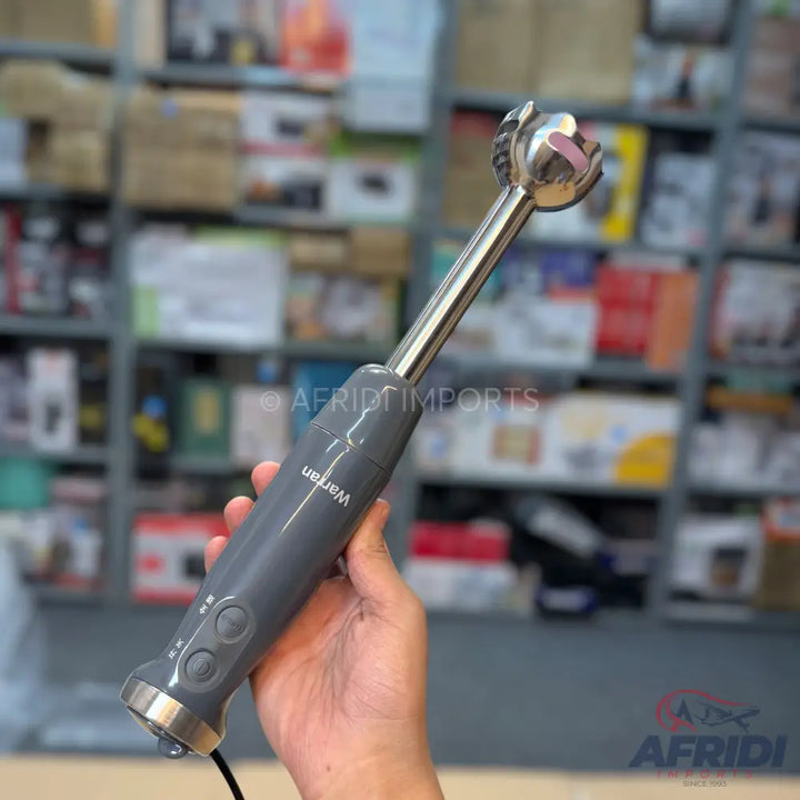Gray immersion blender with a stainless steel shaft and blending head.