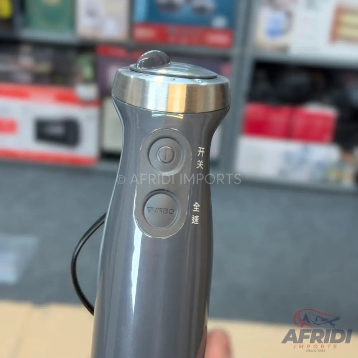 Gray handheld immersion blender with power and turbo buttons.