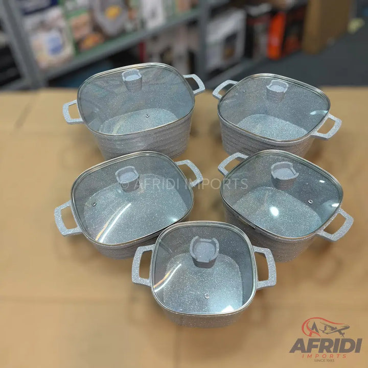 Set of five square-shaped cooking pots with glass lids and textured gray finish.