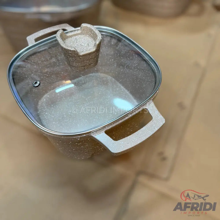 Square-shaped speckled non-stick cooking pot with glass lid and two side handles.