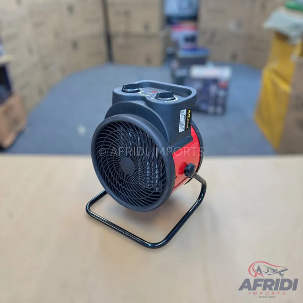 Black and red portable electric fan heater with a carry handle and two control knobs.