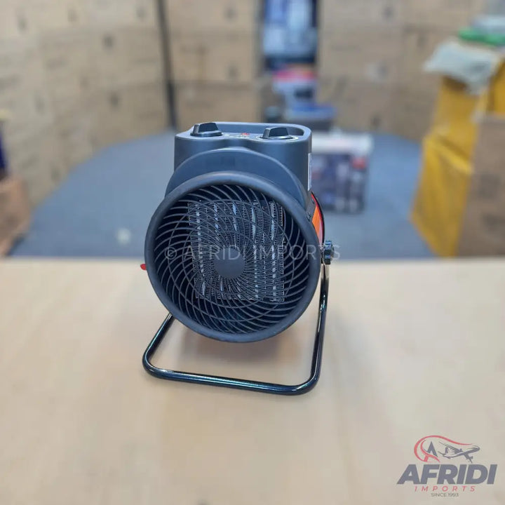 Compact electric fan heater with two control knobs.