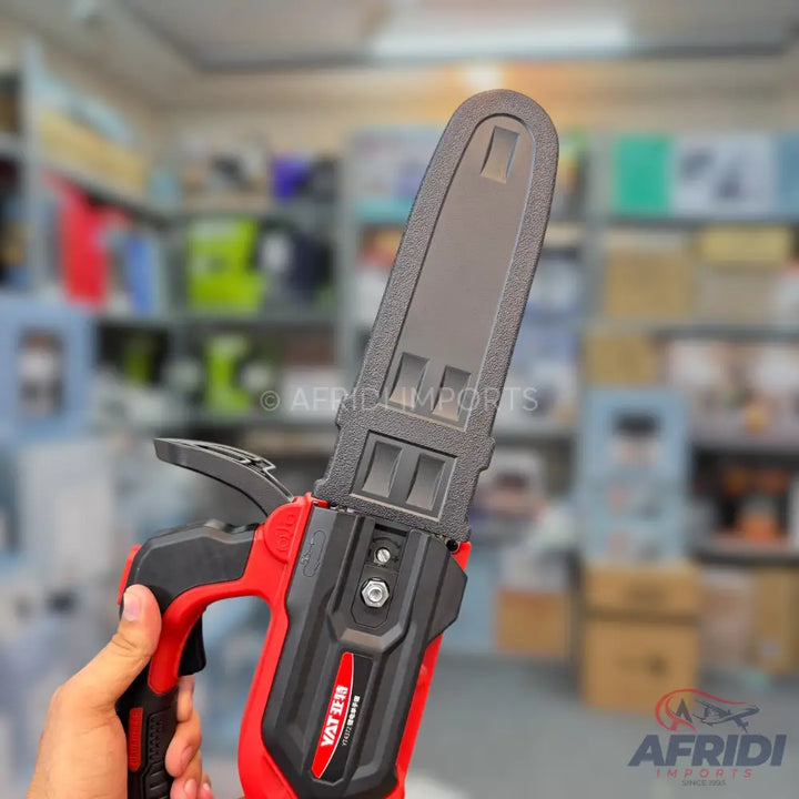 Red and black handheld mini chainsaw.
