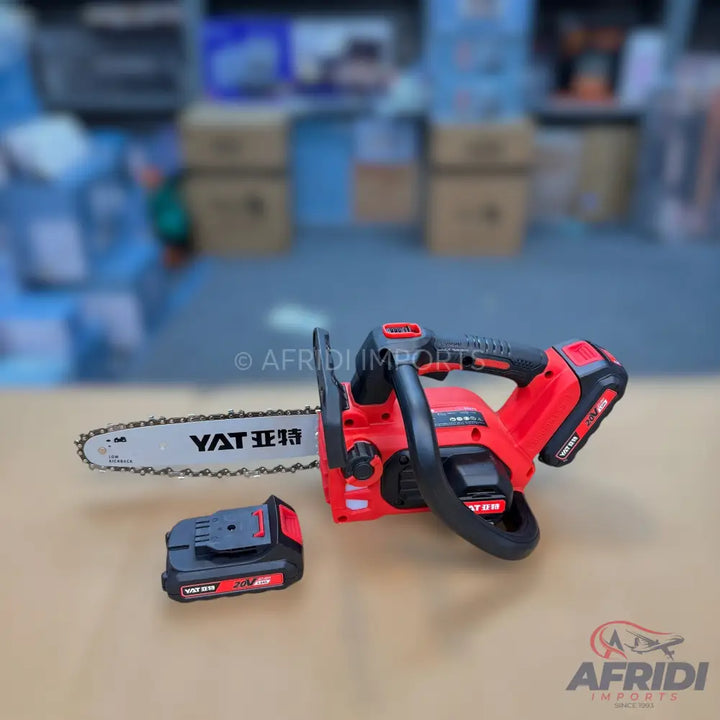 Red and black cordless electric chainsaw with a detachable battery pack.