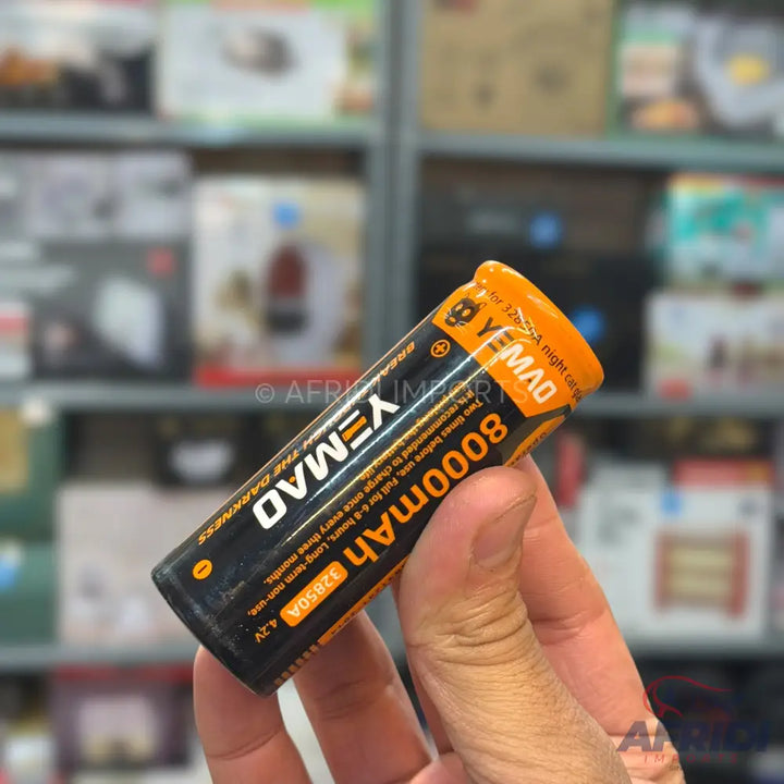 A black and orange rechargeable battery with 8000mAh capacity.
