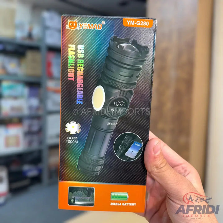 A black USB rechargeable flashlight with a digital display, a side COB light, and a powerful LED beam.